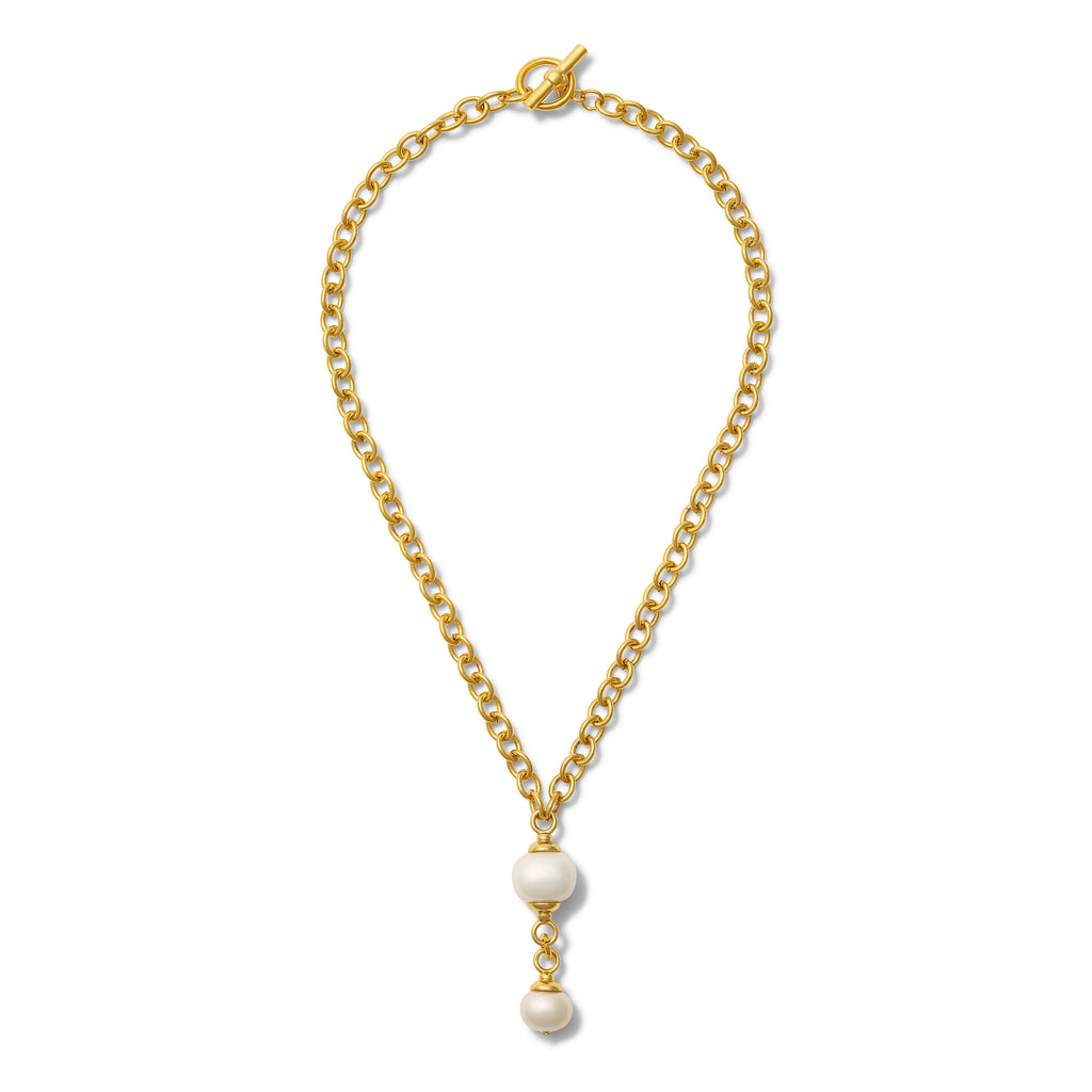 Gold chain necklace with pearl pendants on a white background